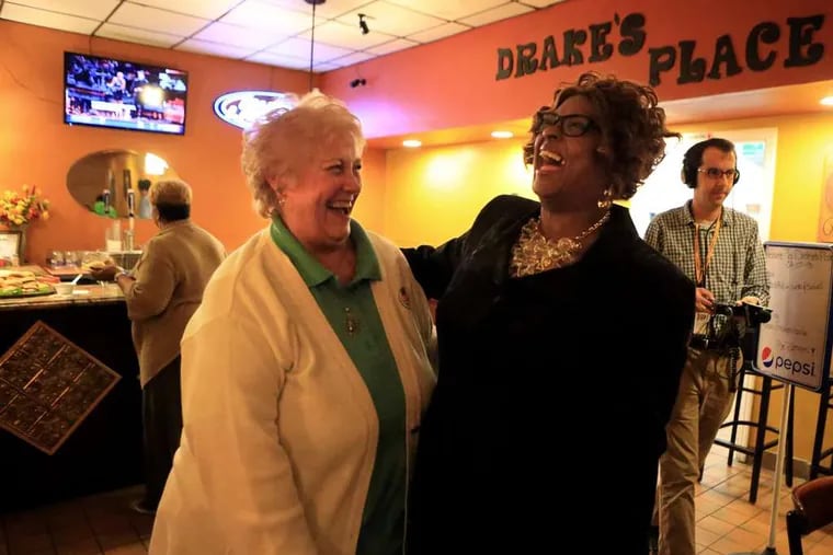 Ella Jones (right), who was seeking a City Council seat, is greeted by supporter Tana Cofer at her election party. She defeated three others for the right to represent the First Ward.