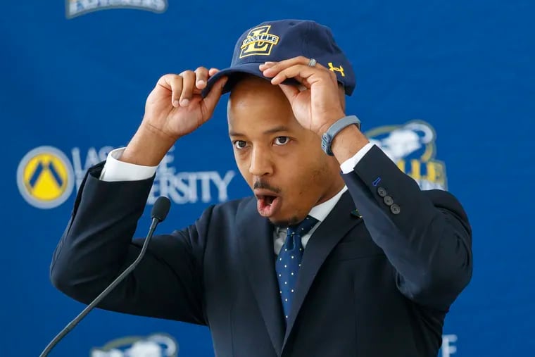 As he donned his La Salle University hat, athletic director Brian Baptiste exclaimed. "Go Explorers" at the press conference announcing his hiring on June 18, 2019 at Founders Hall at the university.