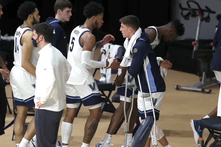 Collin Gillespie of Villanova is greeted by teammates after their victory over Creighton. Gillespie left the game with a knee injury against Creighton during the first half.