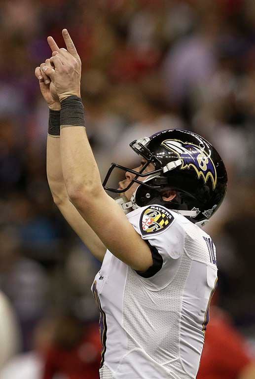 Baltimore Ravens safety Ed Reed lifts the Lombardi trophy with linebacker  Ray Lewis watching at Super Bowl XLVII at the Mercedes-Benz Superdome on  February 3, 2013 in New Orleans. Baltimore beats San