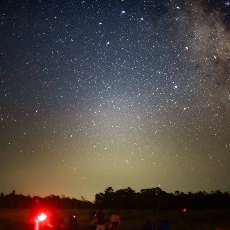 Stargazers, some using less intrusive red lights as flashlights, observe the sky and Perseid meteor shower last August in Shenandoah National Park in Virginia.