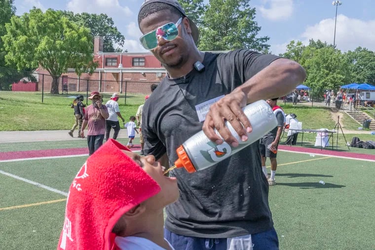 Penn State's Adbul Carter taking part in the Aztec INCRDBL Football Camp for children in Hunting Park last month.