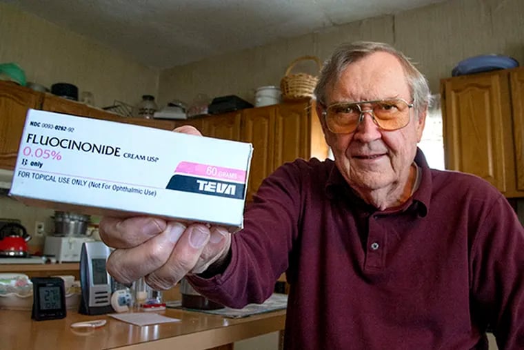 Casimir Janczewski, 74, of Port Richmond, shows the last prescription of generic cream Fluocinonide made by Teva he bought while sitting in his kitchen Nov. 18, 2014. ( CLEM MURRAY / Staff Photographer )