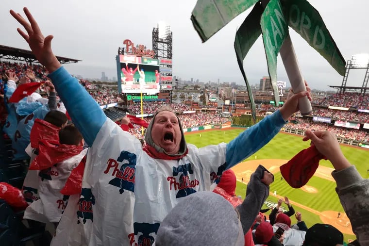 Phillies fans celebrate World Series berth climbing greased poles