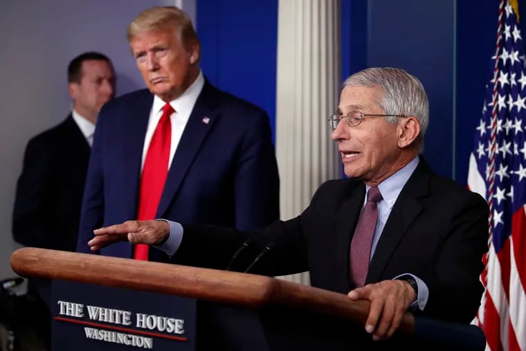 Dr. Anthony Fauci, right, with President Donald Trump at a news conference in April.