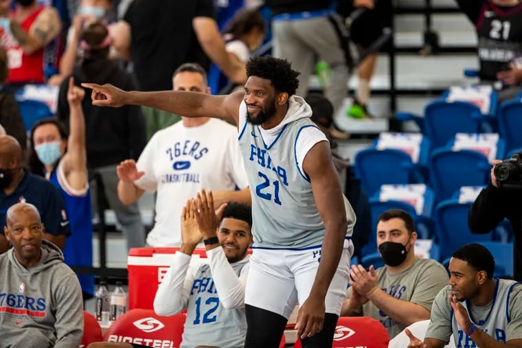 Joel Embiid points to crowd as he was introduced to the fans before the Sixers' scrimmage at Chase Field House in Wilmington, Del., on Saturday, Oct. 9, 2021.