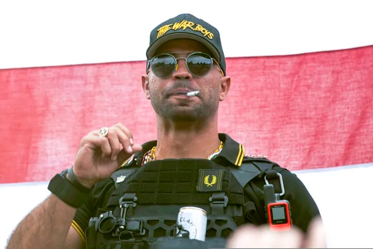 Proud Boys leader Henry "Enrique" Tarrio wears a hat that says The War Boys during a rally in Portland, Ore.  The leader of the far-right Proud Boys extremist group, Tarrio, was arrested Tuesday on a conspiracy charge for his suspected role in a coordinated attack on the U.S. Capitol to stop Congress from certifying President Joe Biden’s 2020 electoral victory.