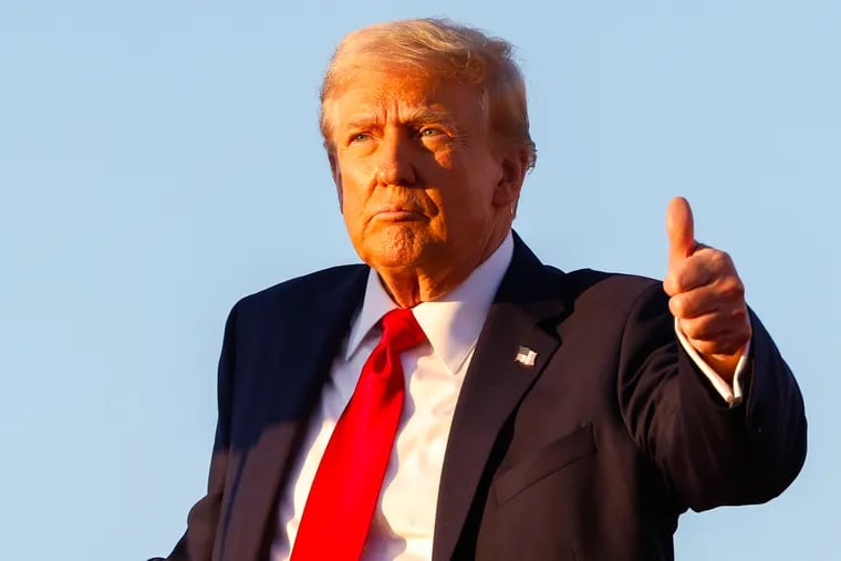 Former President Donald Trump gives a thumbs up while addressing the crowd at a campaign event at the Butler Farm Show grounds Saturday.