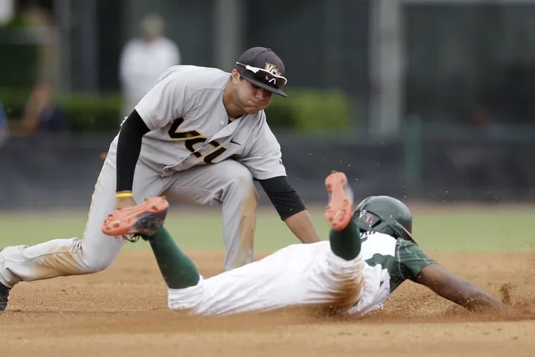 Vimael Machin, then with Virginia Commonwealth, tagging out a Miami runner during the 2015 NCAA Tournament.