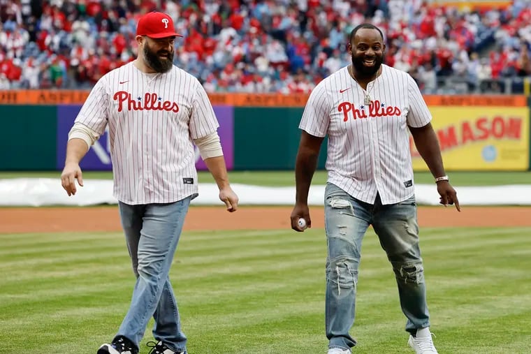 Jason Kelce and Fletcher Cox, having just retired, after throwing out the first pitch at a Phillies game in March.