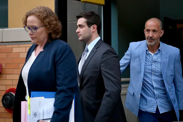 Former Beta Theta Pi house manager Braxton Becker (center) leaves the Centre County Courthouse after being found guilty of one misdemeanor on Thursday, May 30, 2019 in Bellefonte, Pa. Becker was accused of intentionally deleting basement video from the fraternity house after Pennsylvania State Univeristy sophomore Tim Piazza fell down the steps in 2017.     (Abby Drey/Centre Daily Times via AP)