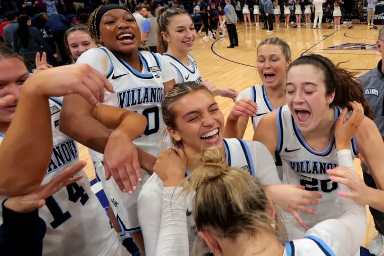 The Villanova women run towards Maddie Burke (bottom right) as they celebrate after their 64-61 victory over St. John's on Jan. 14, 2023 at the Finneran Pavilion at Villanova University. Burke hit two key 3-pointers in the final minutes. Maddy Siegrist (right) led all scorers with 32 points.