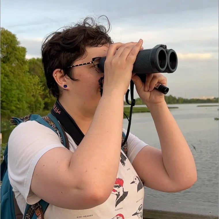 Elise Greenberg, one of the founding members of Philly Queer Birding, bird watching at John Heinz Refuge in May 2024.