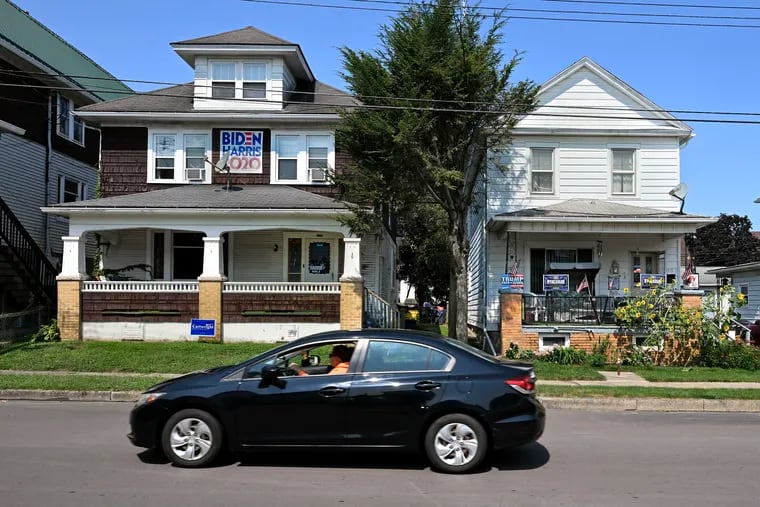 Neighboring Democrat (left) and Republican (right) homes on East Ridge Street in the former mining town of Nanticoke in Luzerne County.