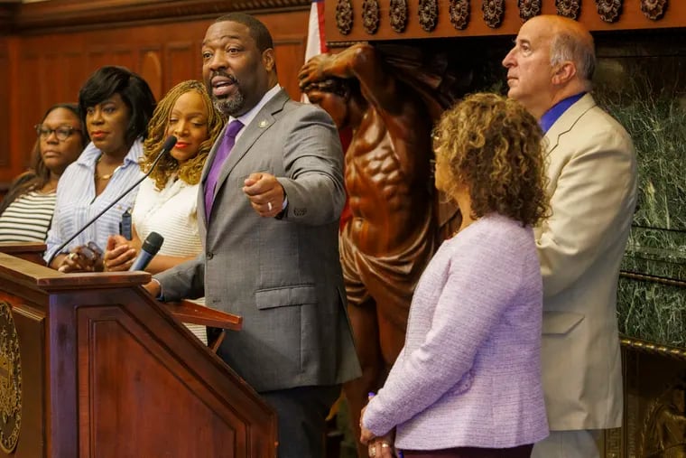 Philadelphia City Council President Kenyatta Johnson speaks during a news conference about the city budget Thursday at City Hall. From left are Councilmember Kendra Brooks, Mayor Cherelle Parker, and Councilmembers Jamie Gauthier, Quetcy Lozada, and Mark Squilla.