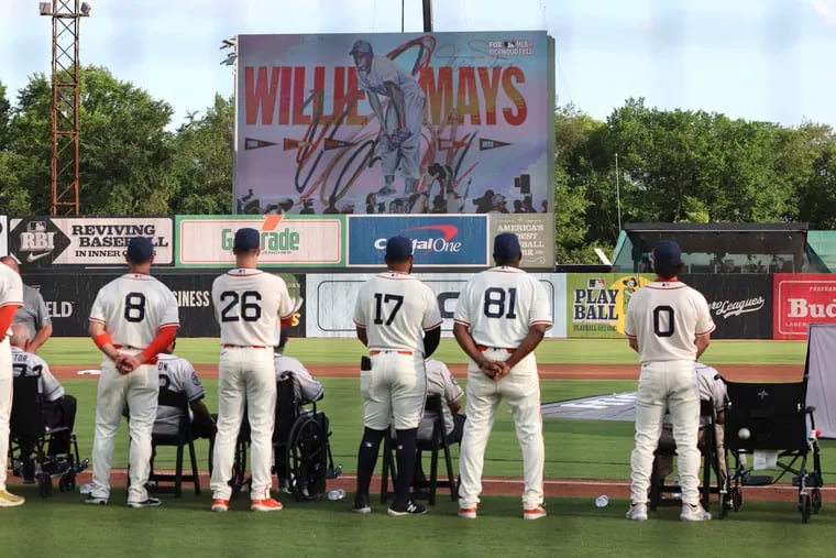 Players pause to honor Willie Mays before the start of a game between the St. Louis Cardinals and the San Francisco Giants on Thursday at Rickwood Field in Birmingham, Ala.