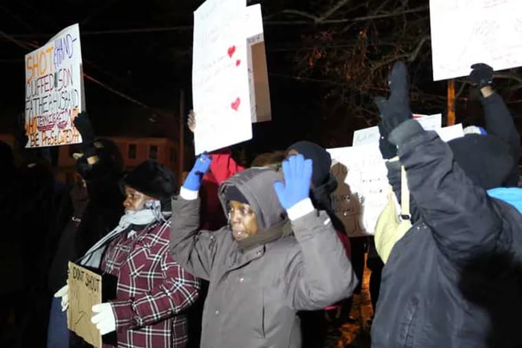 Demonstrators participate in a march in Bridgeton, N.J., earlier this month to protest the shooting death of Jerame Reid who was killed by Bridgeton police after a traffic stop on Dec. 30. (AP Photo/The Press of Atlantic City, Edward Lea)