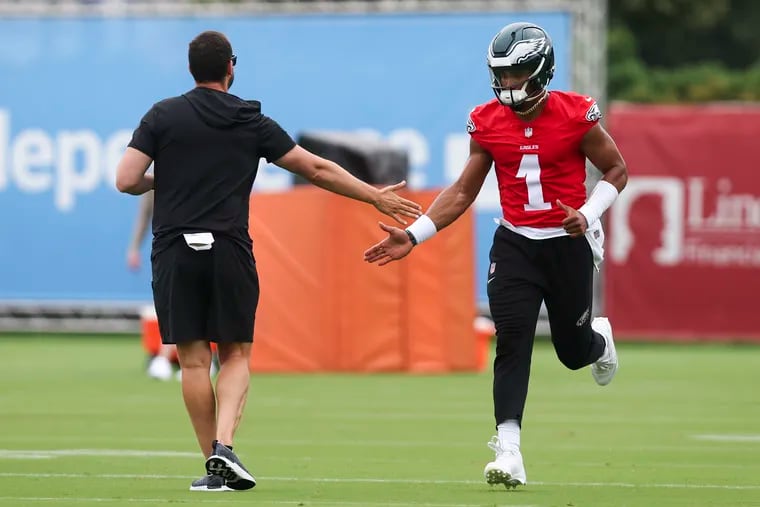 Eagles quarterback Jalen Hurts greets head coach Nick Sirianni during the first day of training camp on Wednesday, July 24, 2024.