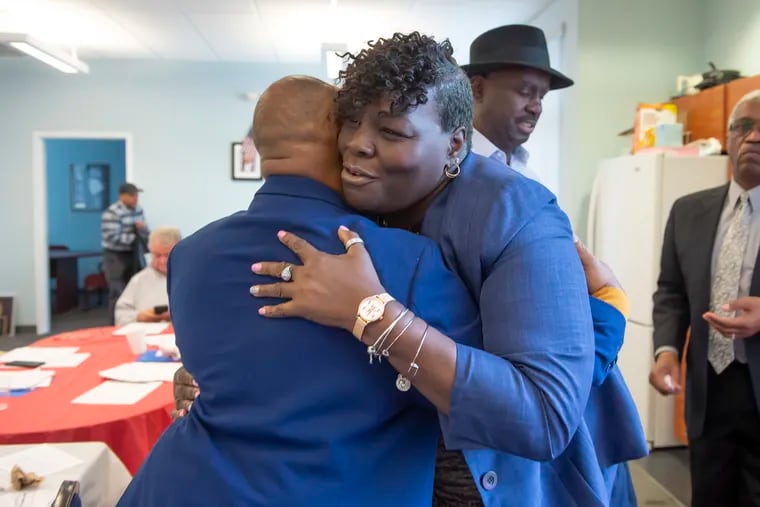 Roni Green embraces 44th Ward Leader Willie Jordan after being nominated to run in the February 25th special election for the 190th District of the state house in West Philadelphia. (Jonathan Wilson / For the Inquirer)