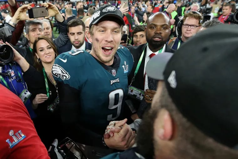 Eagles quarterback Nick Foles celebrates with center Jason Kelce after winning Super Bowl LII.