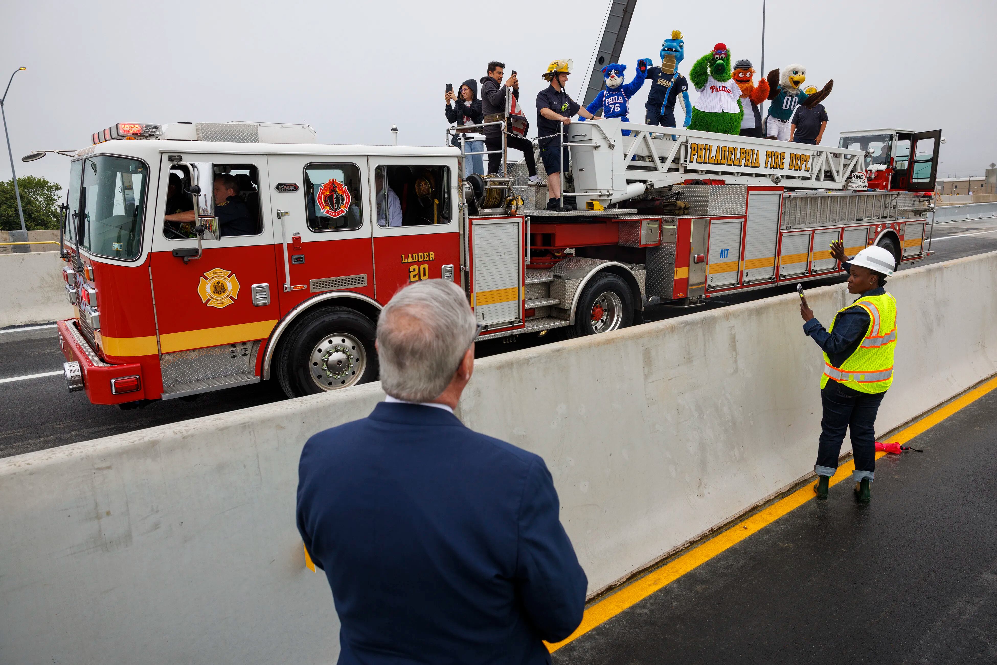 Philly Fire Dept. & team mascots celebrate the reopening of temporary lanes  after I-95 collapse 