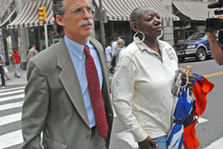 Diane Floyd, Eric DeShawn Floyd&#0039;s mother, left the hearing yesterday in Center City with lawyer Jules Epstein.