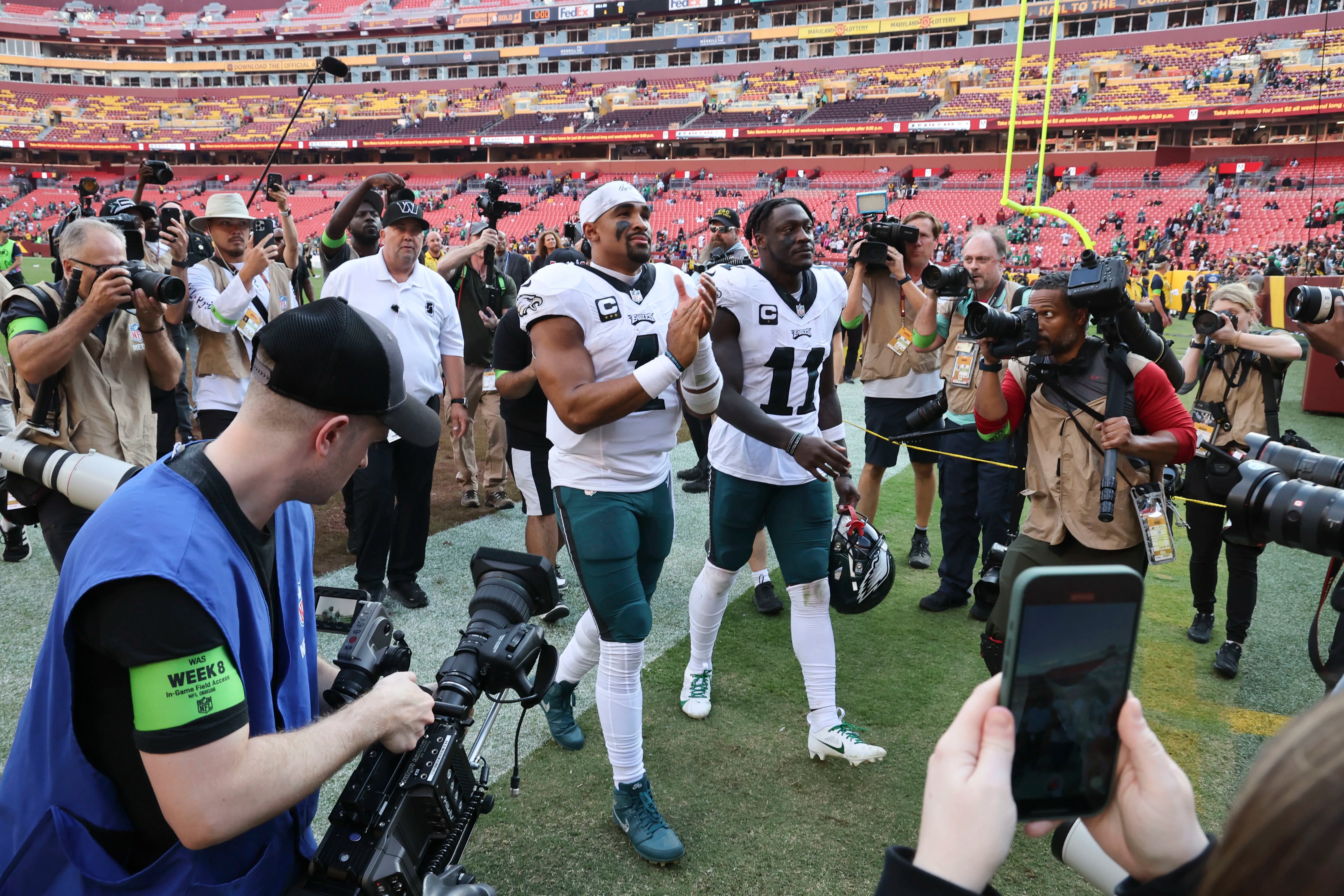 Philadelphia Eagles quarterback Jalen Hurts and Philadelphia Eagles wide receiver A.J. Brown walk off the field after beating the Washington Commanders 38-31at FedEx Field on Sunday, Oct. 29, 2023, in Landover, Md.