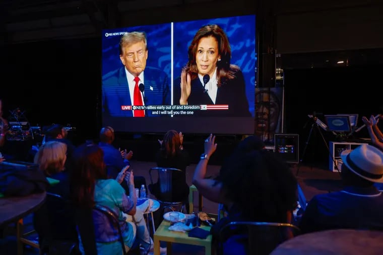 Vice President Kamala Harris speaks about former President Donald Trump’s rallies as people watch the debate at a Dems watch party at the Cherry Street Pier in Philadelphia.