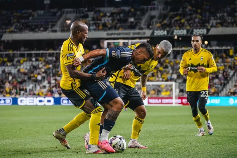 Union midfielder Jesús Bueno (center) tries to keep the ball from Columbus Crew stars Darlington Nagbe (left) and Juan "Cucho" Hernández during Wednesday's Leagues Cup semifinal loss.