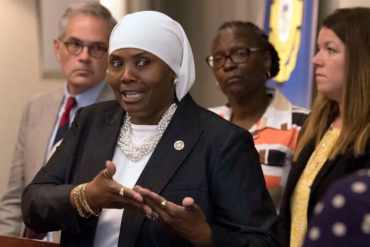 In this Aug. 1, 2018 photo, Movita Johnson-Harrell, interim Supervisor Victim Witness Services, speaks at a news conference in Philadelphia. Johnson-Harrell, the first female Muslim member of the Pennsylvania House of Representatives, said Tuesday, March 26, 2019, she was offended by a colleague's decision to open a voting session with a prayer a day earlier that "at the name of Jesus every knee will bow." (Jose F. Moreno/The Philadelphia Inquirer via AP)