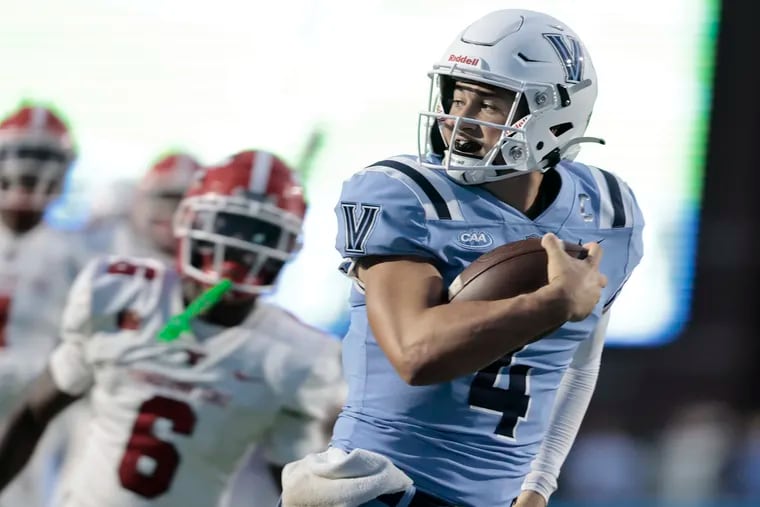 Villanova’s quarterback # 4 Connor Watkins looks behind him as he runs into the end zone for a touchdown in the first half of the Youngstown State at Villanova University football game on Thursday August 29, 2024.