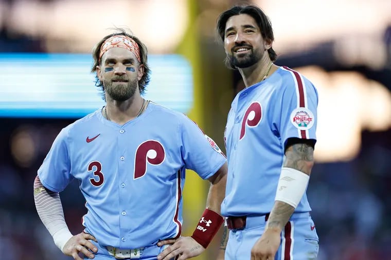 Phillies Bryce Harper and Nick Castellanos during a break against the Los Angeles Dodgers on Thursday.