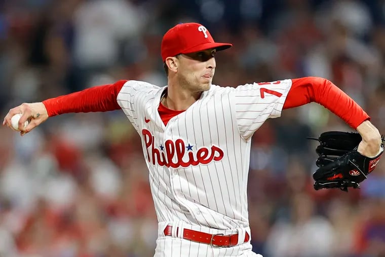 Philadelphia Phillies relief pitcher Connor Brogdon (75) delivers a pitch  in the bottom of the seventh inning in a baseball game against the Texas  Rangers in Arlington, Texas, Sunday, April 2, 2023. (