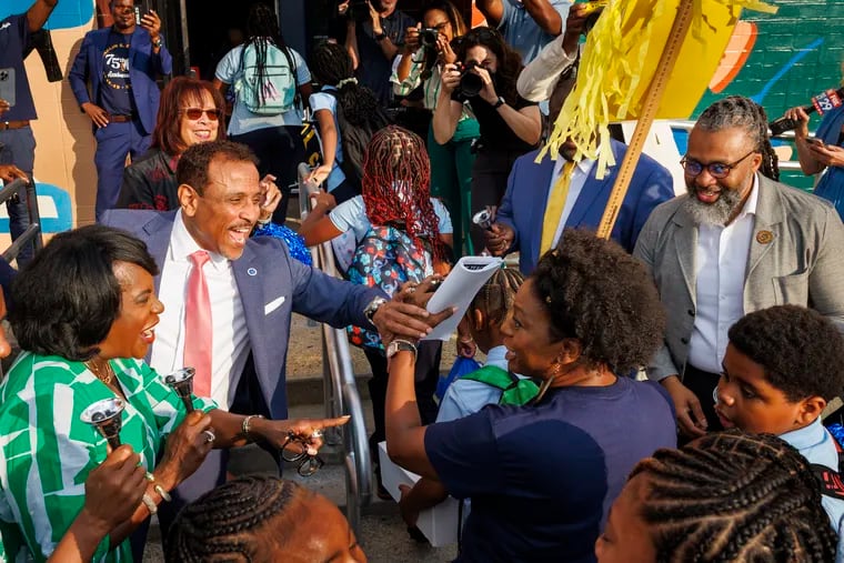 Philadelphia Superintendent Tony B. Watlington Sr. (center) greets students and staff on the first day of the 2024-25 school year at F.S. Edmonds Elementary in East Mount Airy.