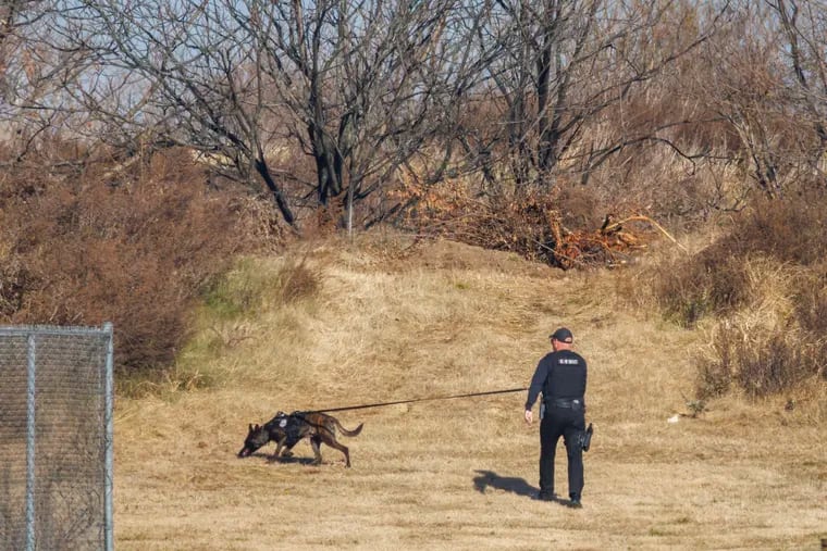 Police K-9 officer with dog searching for Gino Hagenkotter, who escaped prison on Thursday, Nov. 30, 2023.