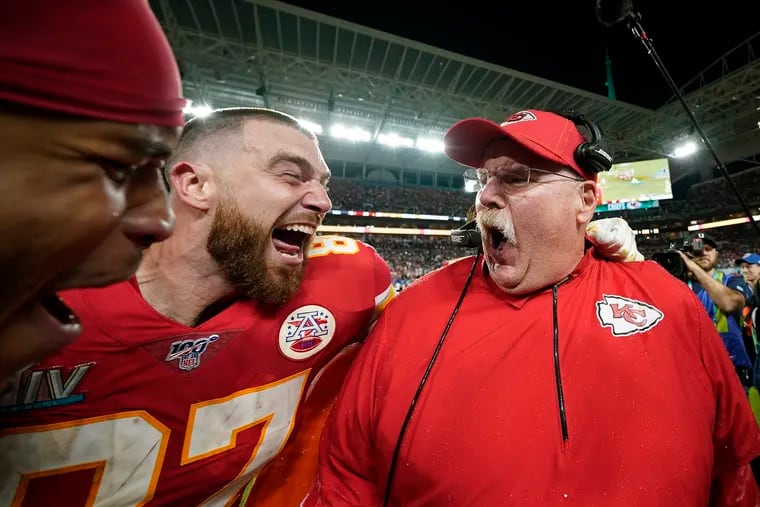 Kansas City Chiefs' Travis Kelce (left) celebrates with head coach Andy Reid after defeating the San Francisco 49ers, 31-20, in Super Bowl 54 football game Sunday, Feb. 2, 2020, in Miami Gardens, Fla.