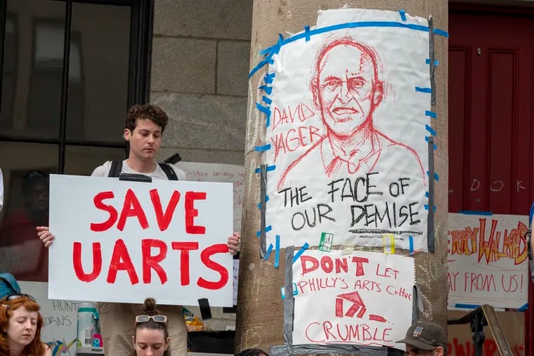 A drawing of David Yager, former president of the University of the Arts, immediately before Kerry Walk - is on a column outside Hamilton Hall on their campus as students, staff, and faculty rally before marching to 1500 Market and another rally in front of the former law offices of UArts chair Jud Aaron.