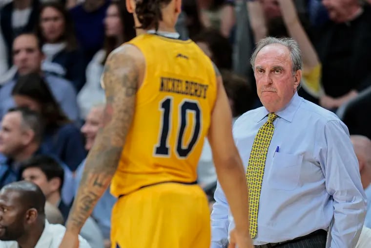 LaSalle coach Fran Dunphy talks with Josh Nickelberry. “It’s all about defense with the coach over here,” Nickelberry said.