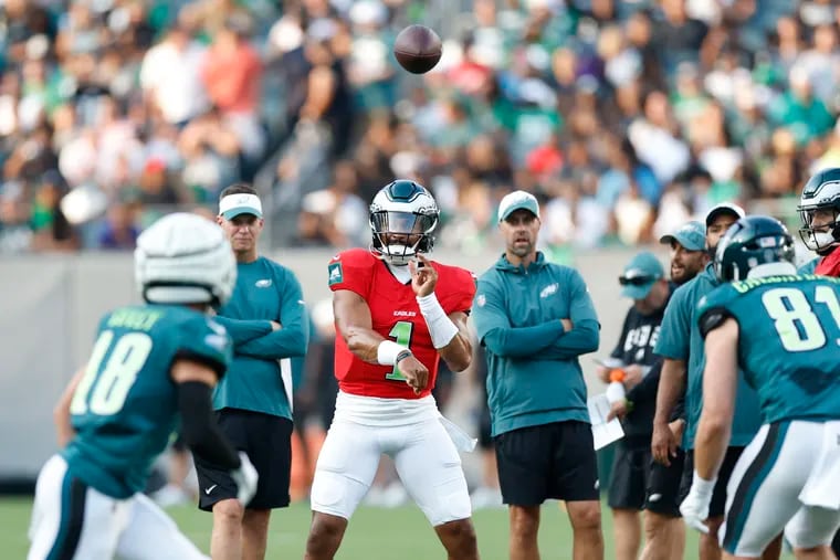 Eagles quarterback Jalen Hurts fires a pass to wide receiver Britain Covey during the public practice at Lincoln Financial Field on Thursday.