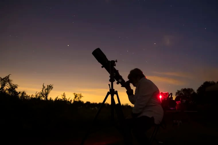 Bea Mazziotta of Broomall uses a telescope during a stargazing event with the Chester County Astronomical Society at the Bucktoe Creek Preserve in 2018.