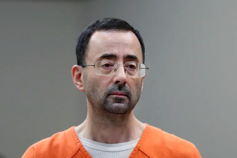 Disgraced former sports doctor Larry Nassar appears in court for a plea hearing on Nov. 22, 2017, in Lansing, Mich.