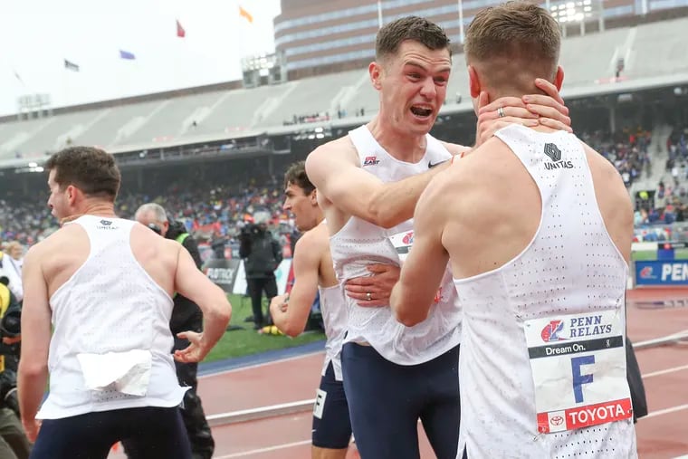 Villanova celebrates finishing first in the College Men's 4xMile Championship of America race on the third and final day of the 2023 Penn Relays at Franklin Field in Philadelphia on Saturday, April 29, 2023.