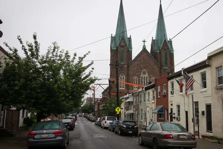 The St. Laurentius Church in Fishtown is known for its soaring copper spires. Its facade has begun to deteriorate in recent years.