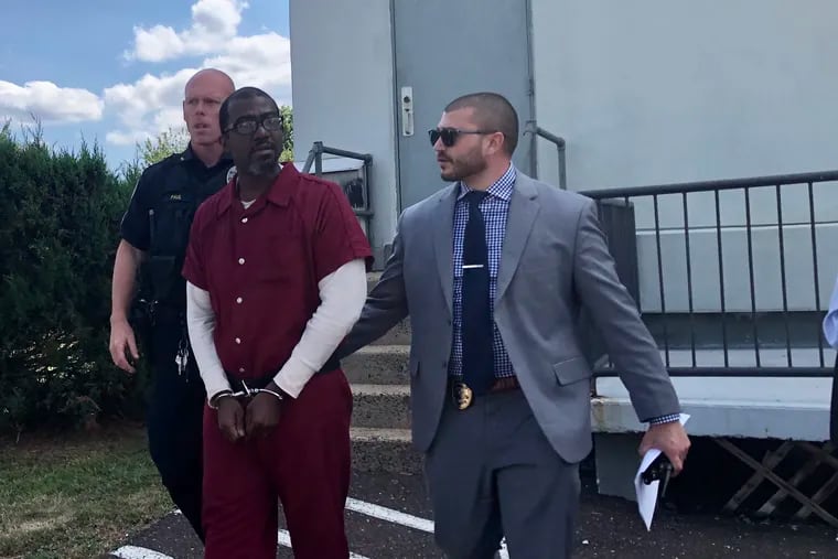 Maurice Byrd Jr. is escorted outside of district court in Hatboro after his preliminary hearing on murder and related charges Thursday.