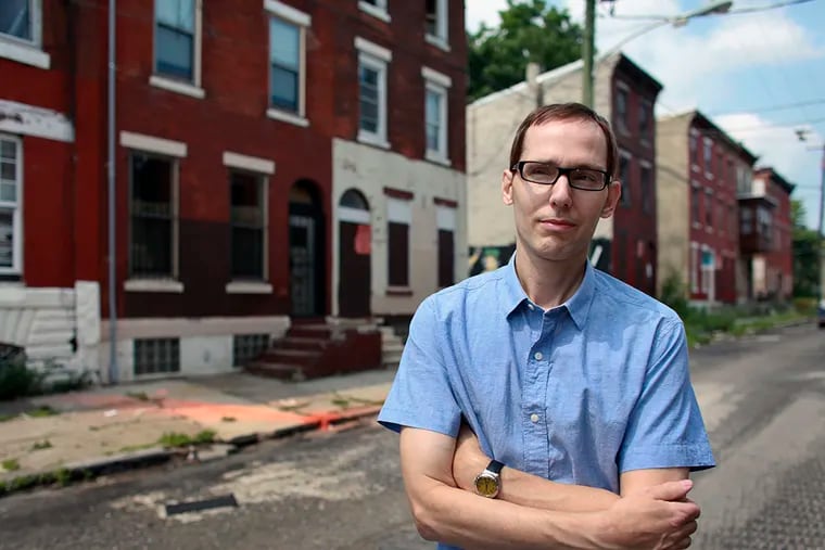 Developer Glenn Mancini in front of a property he is renovating on Master Street in North Philadelphia. The Philadelphia Housing Authority is taking two of his properties, and 1,300 others, in the neighborhood. (JOSEPH KACZMAREK / For The Inquirer)