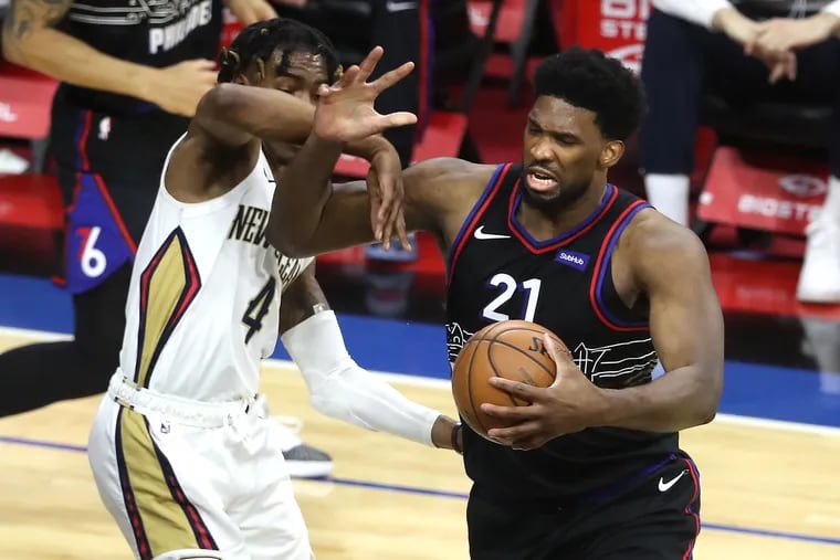 Joel Embiid, right, and the Sixers are that much closer to securing the Eastern Conference's No. 1 seed.