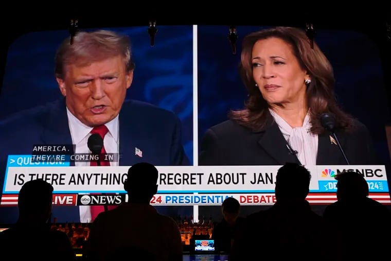 People watch the presidential debate between former President Donald Trump and Vice President Kamala Harris on Tuesday at the Gipsy Las Vegas in Las Vegas.