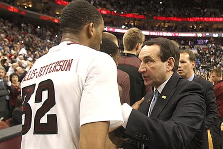 Rahlir Hollis-Jefferson gets congratulations from Duke coach Mike Krzyzewski after the Owls' win. (Charles Fox/Staff Photographer)