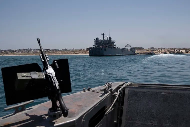 A U.S. Army vessel is seen moored at the U.S.-built floating pier Trident that connects to the beach on the coast of the Gaza Strip on Tuesday, June 25, 2024.