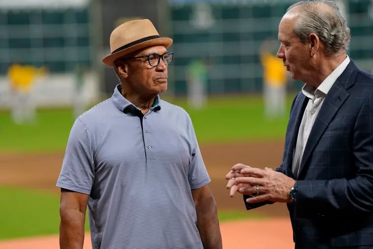 Hall of Fame member and special assistant to the owner Reggie Jackson, left, talks with Houston Astros owner Jim Crane in 2022.